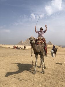 Kay riding a camel in Giza